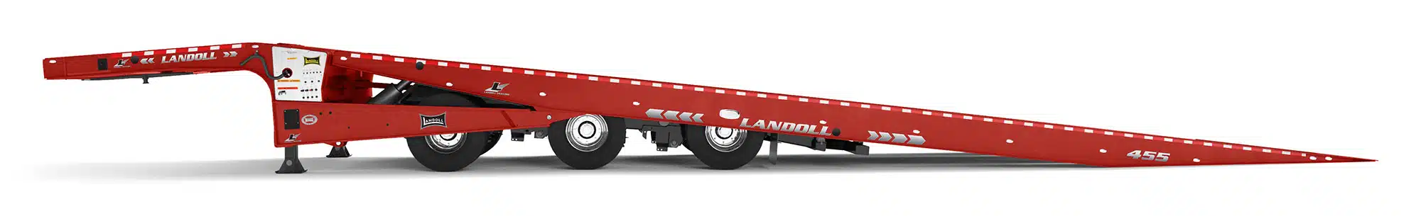 Side view of a red travelling axle trailer with its deck lowered